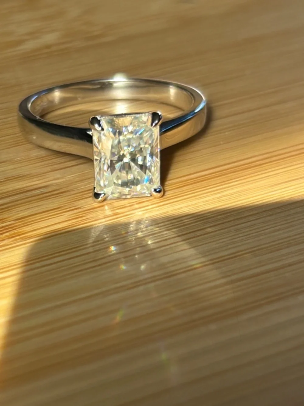 A certified 3ct radiant Moissanite solitaire in solid sterling silver and 18k!